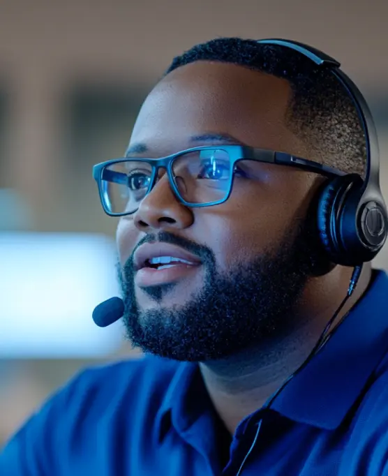 adult man wearing a headset engaged in conversation